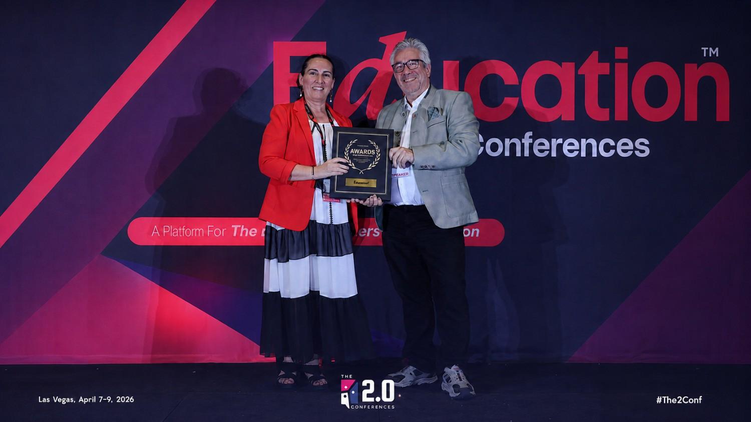 Receiving the 2026 Excellence in Education Award on stage in Las Vegas